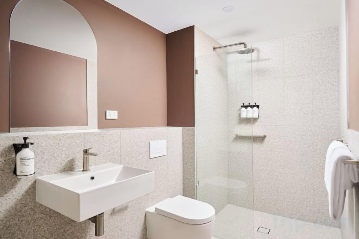 Shower, rainfall showerhead, hair dryer, towels