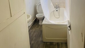 A bathroom with a toilet, a sink, and a shower area. - Beautiful portable single room in an apartment  (Bury)