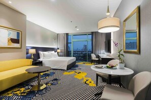 프레지덴셜 콘도, 킹사이즈침대 1개 및 소파베드, 강 전망 | 거실 | 케이블 채널 시청이 가능한 17인치 평면 TV, 벽난로, 비디오 게임기