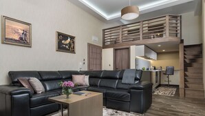 Maisonette I | Living area | 50-inch Smart TV with cable channels, Netflix, streaming services - Sevtopolis Apartments (Kazanlak)