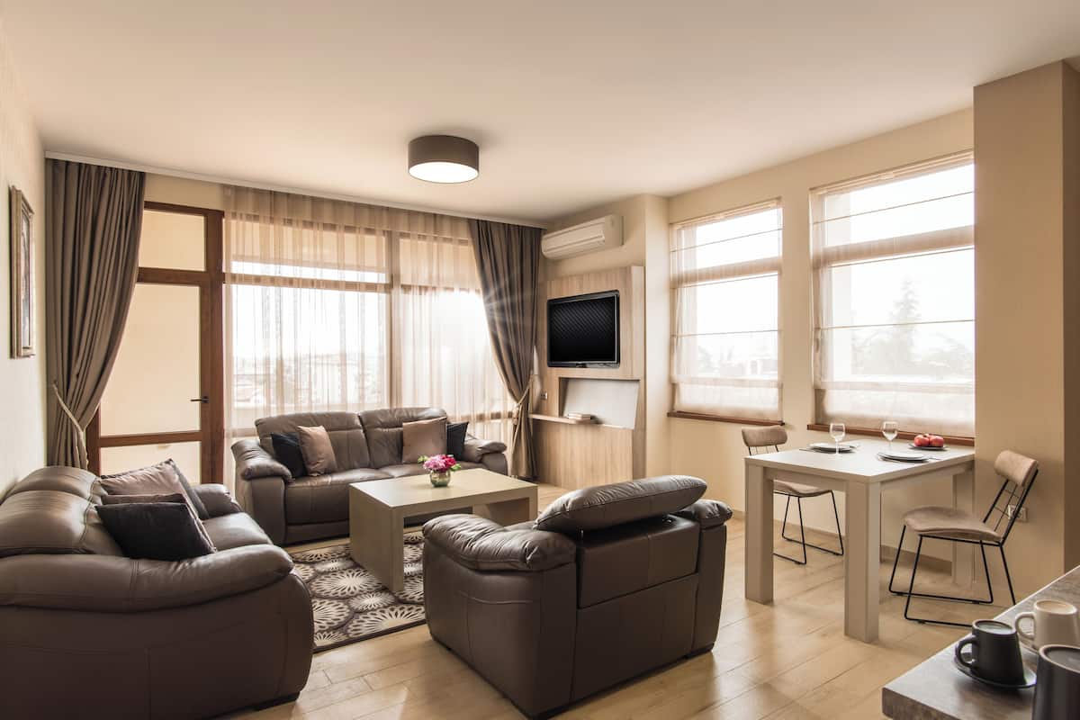 Superior Two-Bedroom Apartment | Living area | 50-inch Smart TV with cable channels, Netflix, streaming services