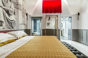 A modern bedroom with a large bed, a red curtain, and a view of the city through a glass door. - 3737 La Catedral by Barbarhouse (Mesagne)