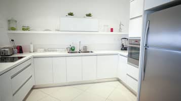Apartment, Balcony, Beach View | Private kitchen | Fridge, microwave, oven, espresso maker