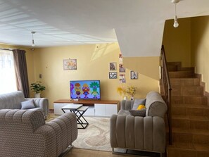 Living area - Cozy 2-bedroom apartment with AC and WiFi in this wonderful home away from home. (Rumuruti)