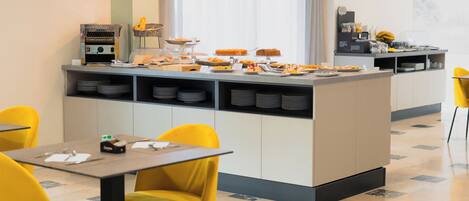 A modern breakfast bar with a variety of food items, a coffee machine, and a seating area with yellow chairs.