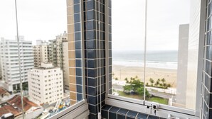 A view from a window with a view of the beach and buildings. - Make Some Memories at This Unique Place (Praia Grande)