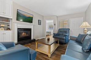 Signature Condo, 2 Bedrooms, Balcony, River View | Living room | 55-inch Smart TV with digital channels, fireplace - River View (Pigeon Forge)