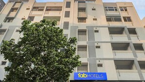 A multi-story hotel building with a modern architectural design, featuring balconies and a prominent logo for 'fab hotels'. - Fabexpress Bb Suites (Hyderabad)
