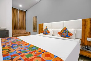 Premium Room | Egyptian cotton sheets, premium bedding, in-room safe, soundproofing - Fabhotel Prime Dumas (Surat)