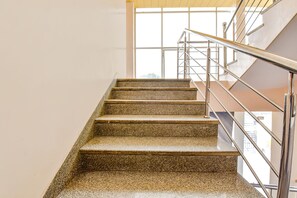 A staircase with granite steps and metal railings, leading to an upper floor. - Fabhotel Bhanwar Niwas (Jaipur)