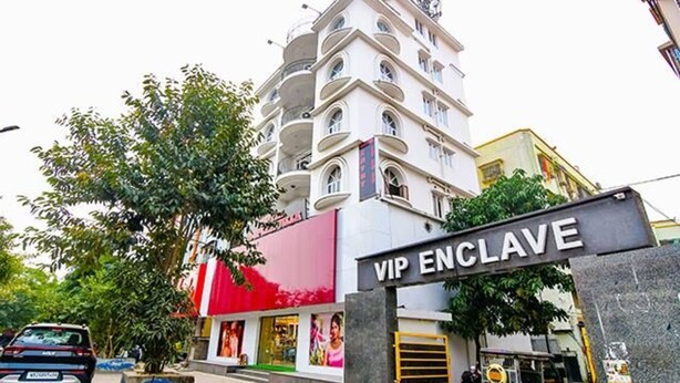A multi-story building with a sign reading "VIP ENCLAVE." - Fabexpress Duplex Villa (Barasat)