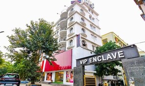 A multi-story building with a sign reading "VIP ENCLAVE." - Fabexpress Duplex Villa (Barasat)