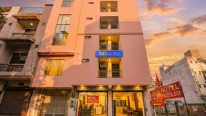 A modern hotel with a sign reading "fabHOTELS" and "HOTEL PEACEFUL STAY" on the facade. - Via Peaceful Stay Palam (New Delhi)