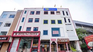 A multi-story building with a 'fabHOTELS' sign at the top. - Fabexpress Taj Prince (Agra)