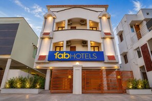 A two-story building with a sign for 'fabHOTELS' and a gated entrance. - FabHotel Harma Residency - near Velachery Railway station (Chennai)