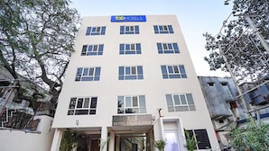A multi-story building with a sign for 'Tab Hotels' and 'Hotel Palace View'. - Fabhotel Prime Palace View (Vadodara)
