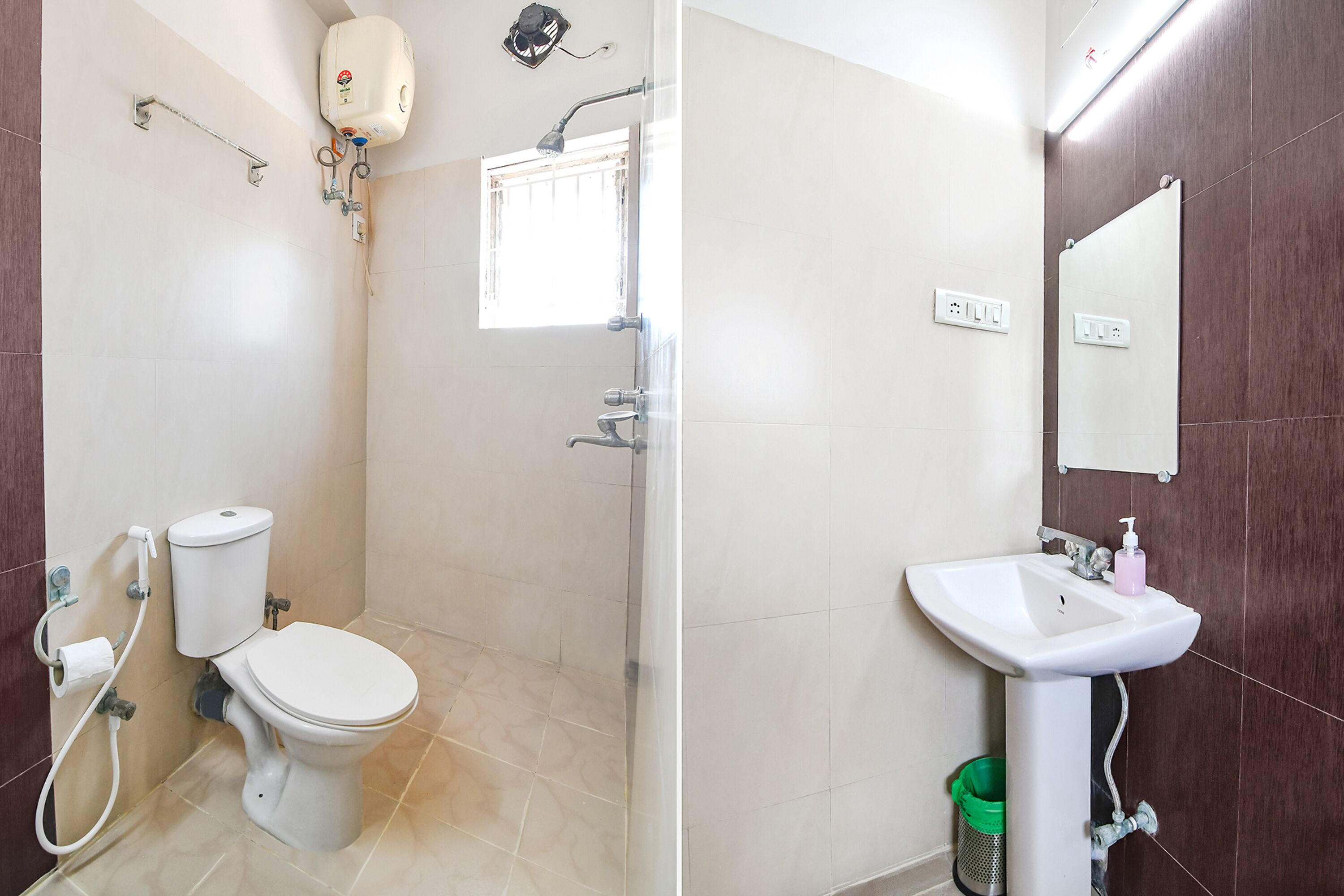 A bathroom with a toilet, shower, and sink.