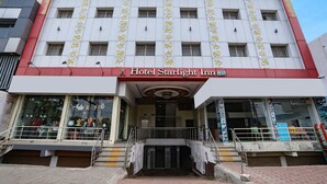 A building with a sign reading "fabHOTELS" and "Hotel Starlight Inn" on the facade. - Fabhotel Starlight Nx (Chhatrapati Sambhajinagar)