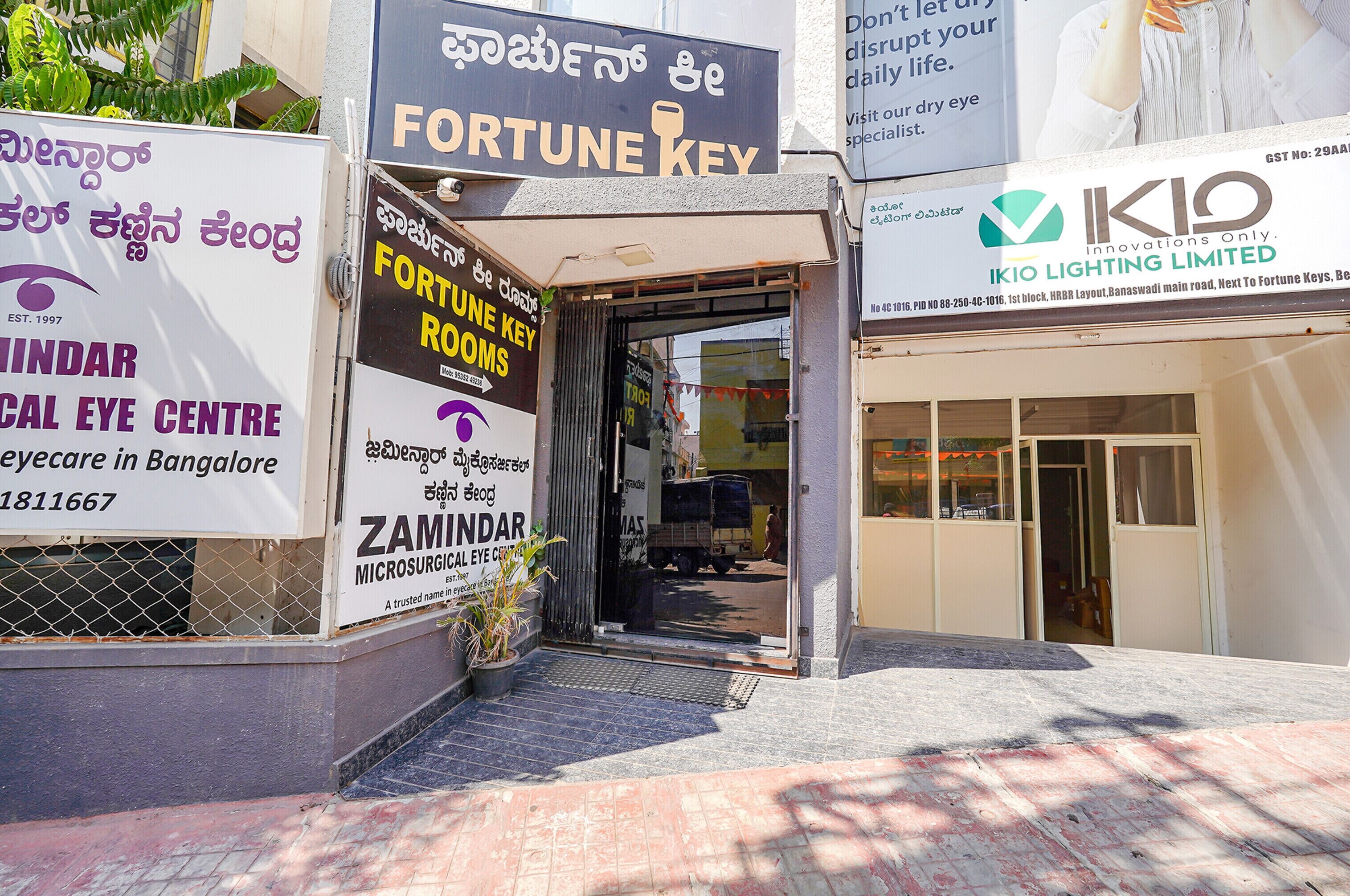 The entrance to a building with signs for 'Fortune Key' and 'ZAMINDAR Microsurgical Eye Centre'.
