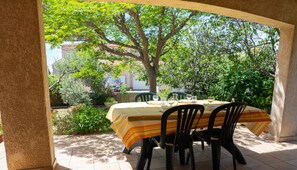 Enjoy dining al fresco amidst lush greenery and a serene atmosphere.