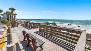 A wooden deck with benches overlooking a beach. - A Tranquil Retreat Amidst 30A's Glorious Beaches (Santa Rosa Beach)