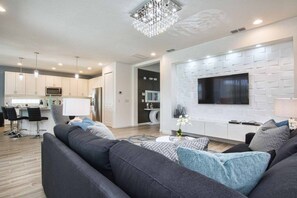 Living area - Beautiful House, Gourmet Grilll, Jacuzzi And Game Room !!! 6 Bedroom Home by RedAwning (Kissimmee)