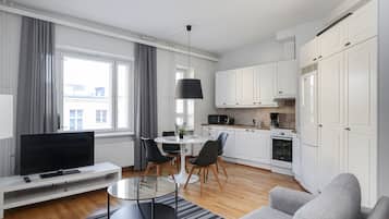 Basic Apartment, City View | Living area | Flat-screen TV
