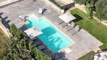 Seasonal outdoor pool, pool umbrellas, pool loungers