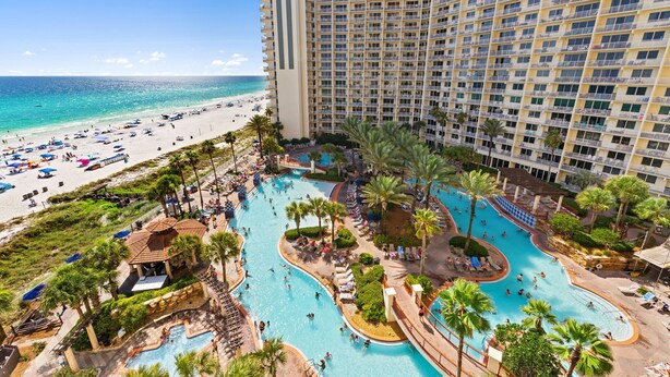 A resort with multiple swimming pools, a beach, and a high-rise hotel. - Ocean view condo w/ pool and hot tub (Panama City Beach)