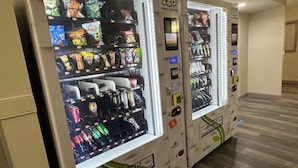 A row of vending machines with a variety of snacks and drinks. - Red Roof Inn Richmond, VA – W Broad St (Richmond)