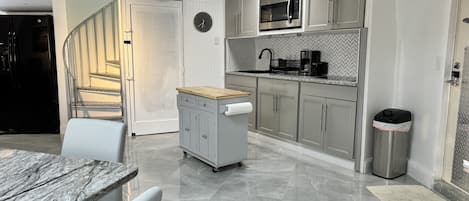 Fridge, microwave, stovetop, coffee/tea maker