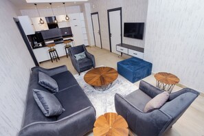 55-inch flat-screen TV with cable channels, TV