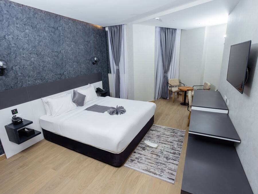 Family Double or Twin Room, City View | In-room safe, desk, laptop workspace, blackout drapes