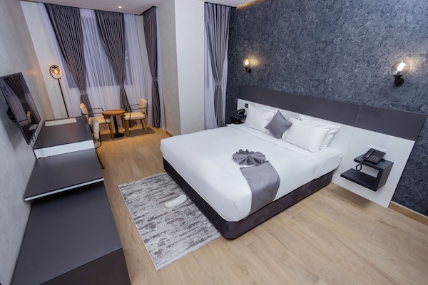 Family Double or Twin Room, City View | In-room safe, desk, laptop workspace, blackout drapes