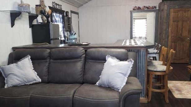 A cozy living room with a dark leather sofa, a coffee station, and a wooden dining table. - Rising Wolf Cabin
Glacier National Park
Centralized location for exploring (East Glacier Park)