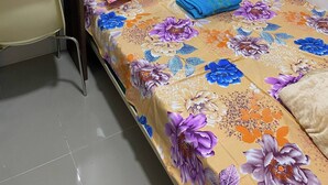 A bedroom with a bed, a desk, and a chair. - Grass Residence T3 34th Floor (Quezon City)
