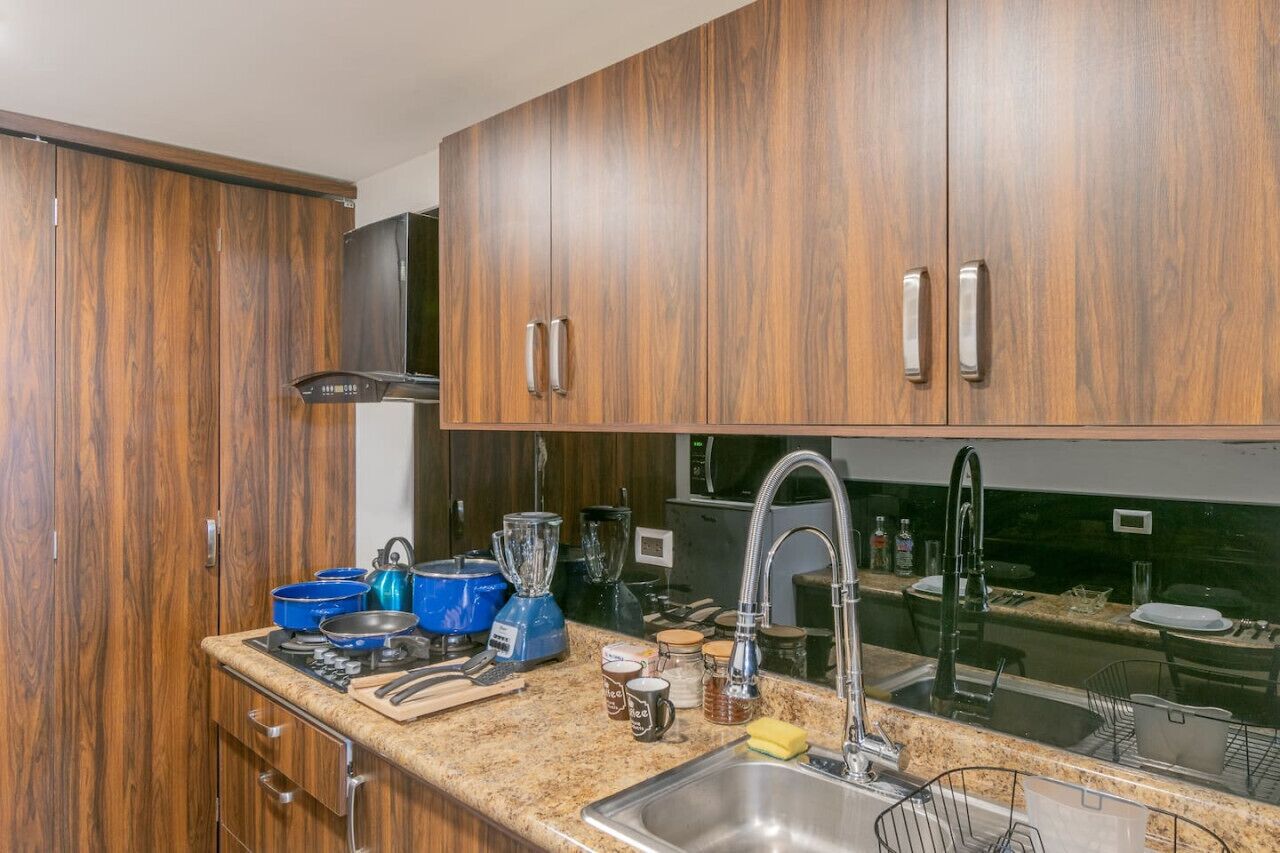 Fridge, microwave, stovetop, cookware/dishes/utensils