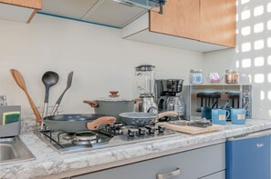 Fridge, microwave, stovetop, coffee/tea maker