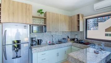 Fridge, microwave, stovetop, coffee/tea maker