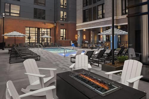 Seasonal outdoor pool, open 8:00 AM to 9:00 PM, pool loungers