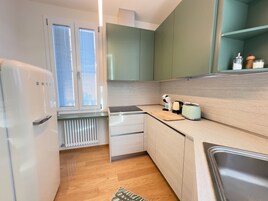 Luxury Apartment | Private kitchen | Full-size fridge, microwave, oven, stovetop