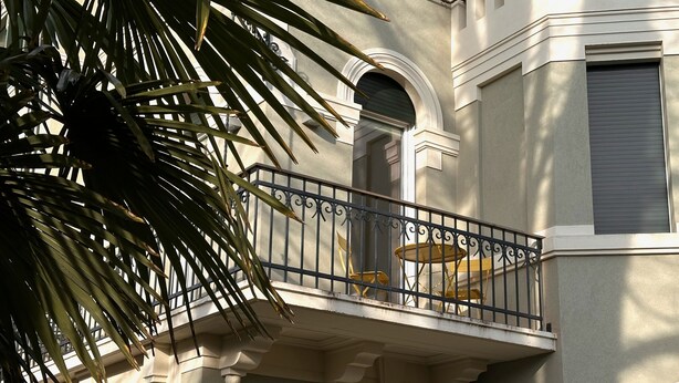 A building with a balcony, a door, and a window. - Villa Ada al Lido (Venice)