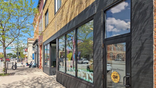 A building with large windows, a black door, and a visible street view. - Prime Downtown Music Lovers Experience! Nostalgic Mid-Mod In Historic St Peter (Saint Peter)