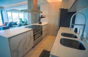 Fridge, oven, coffee/tea maker, cookware/dishes/utensils