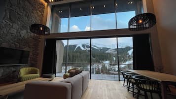 Swiss, Executive Apartment, 3 Bedrooms | Living area | 55-inch Smart TV with digital channels
