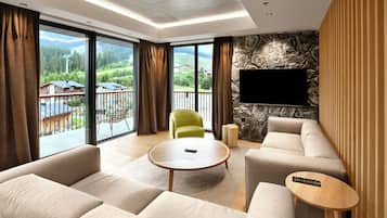 Swiss, Signature Apartment, 3 Bedrooms | Living area | 55-inch Smart TV with digital channels