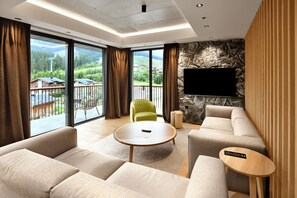 Swiss, Signature Apartment, 3 Bedrooms | Living area | 55-inch Smart TV with digital channels
