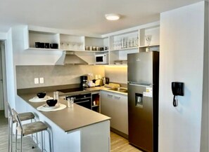 Basic Apartment | Private kitchen | Full-sized fridge, cookware/dishes/utensils