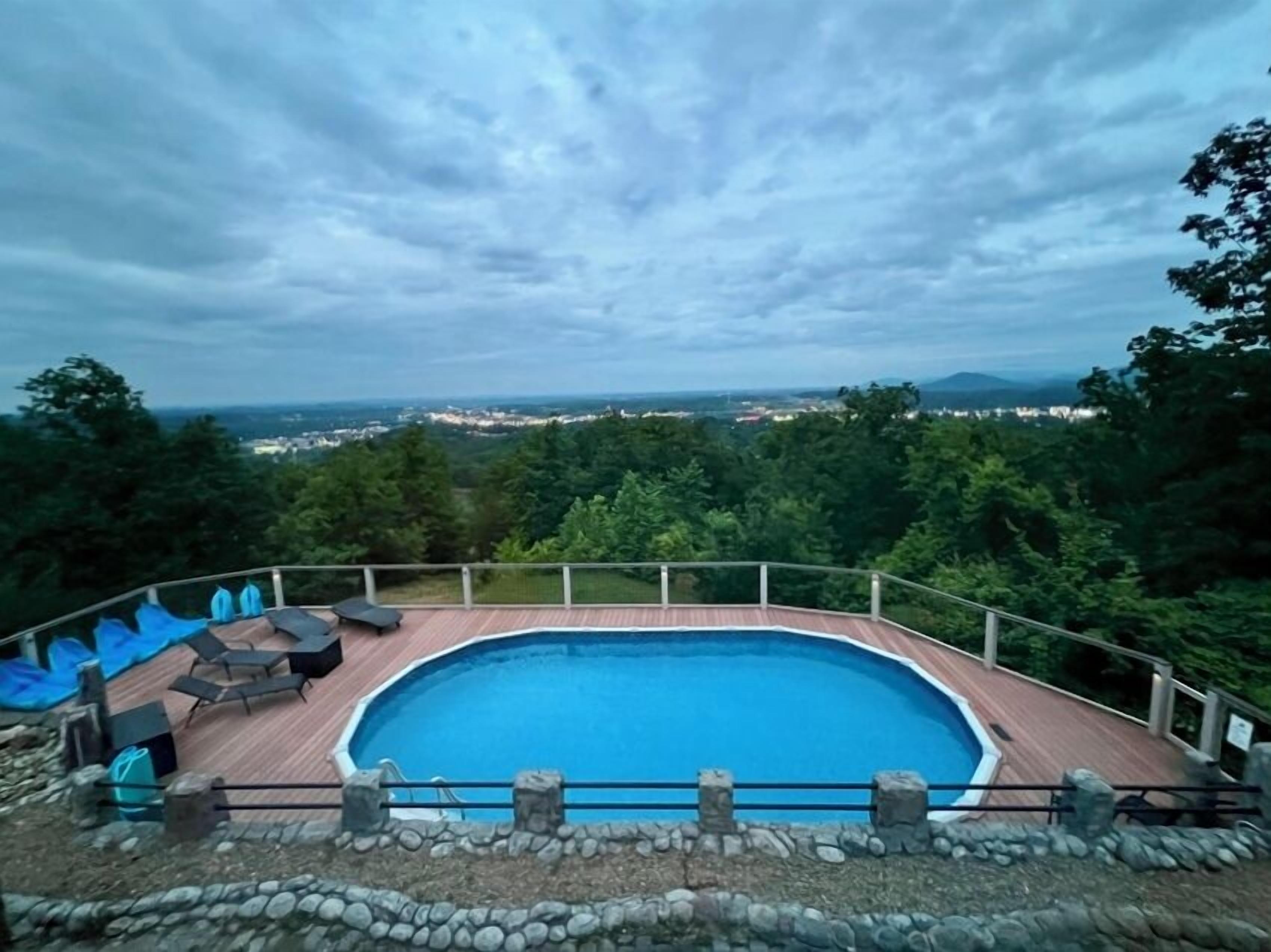 Our large heated outdoor pool and sun deck overlooks Pigeon Forge