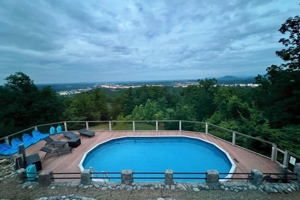 Our large heated outdoor pool and sun deck overlooks Pigeon Forge